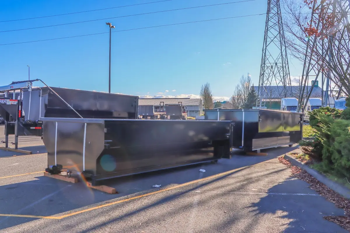 Roll-off dumpster ready for waste disposal at job site for 2 Yard Dumpster Rental in Denison